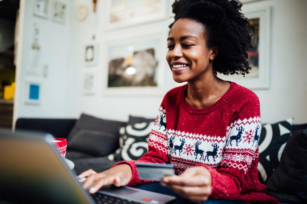 Woman using laptop to shop online.