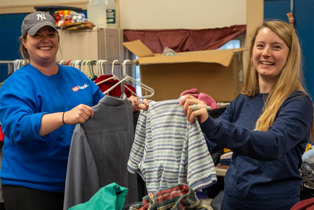 Two female U.S. Bank volunteers at work