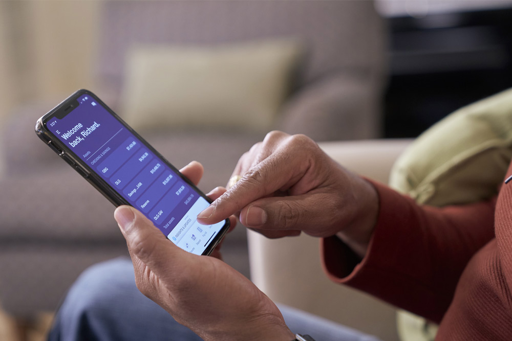 Close up of the U.S. Bank Mobile App with a person using their phone