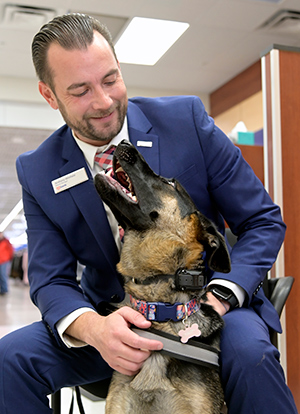 Man with his dog looking up at him.