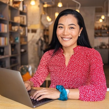 Smiling woman at laptop