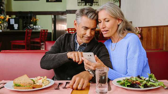 Couple viewing available balance on a phone