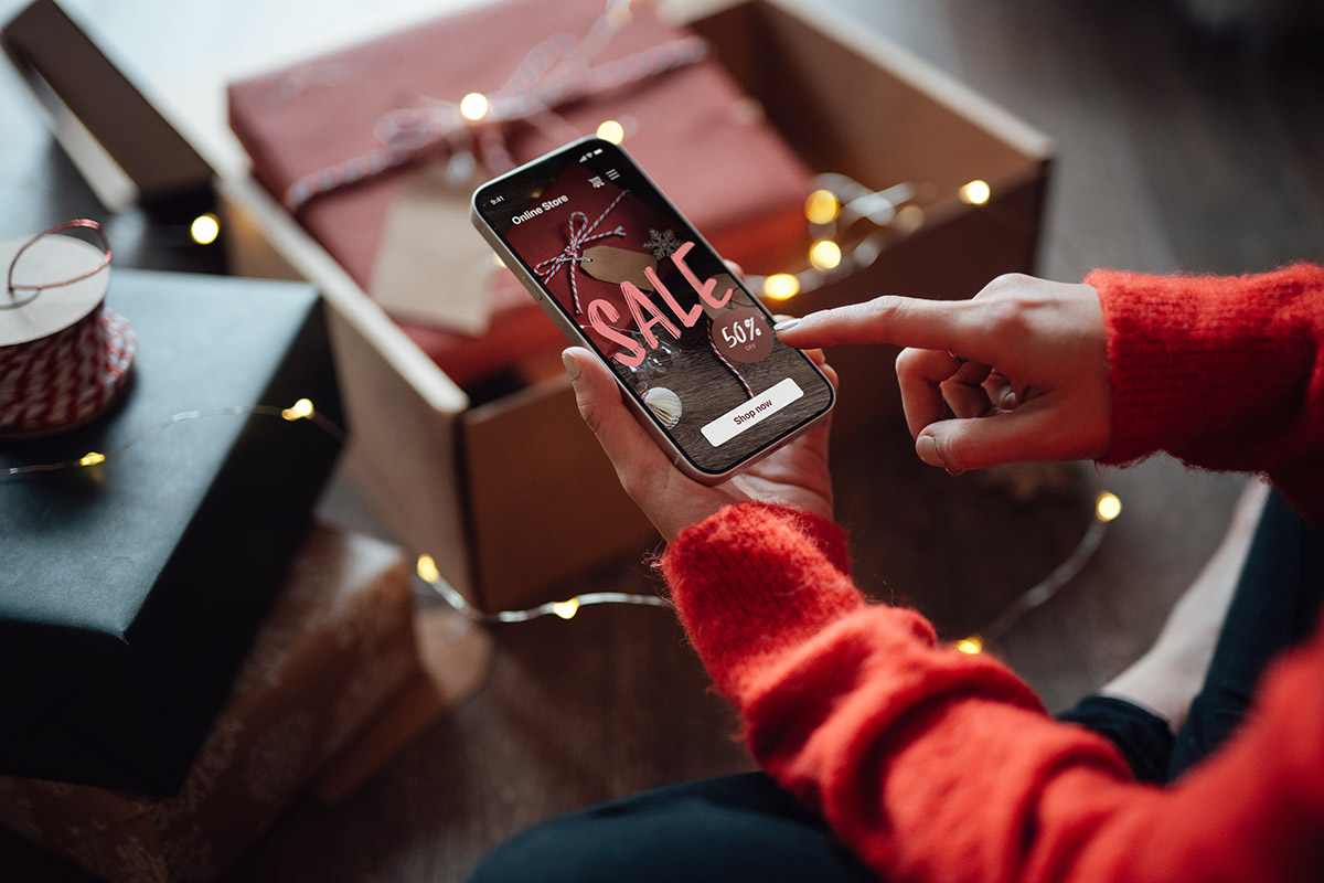 a woman's hands shopping on her phone