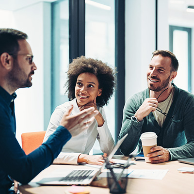 A group of people having a meeting in an office.