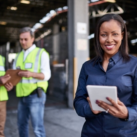 Person standing holding a mobile device