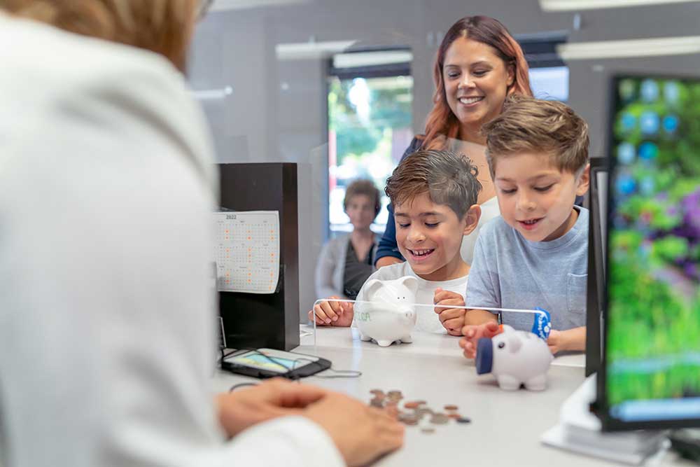 Parent with children opening a bank account