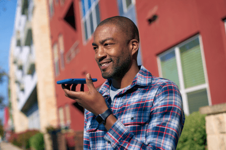 Person using talking into a smartphone