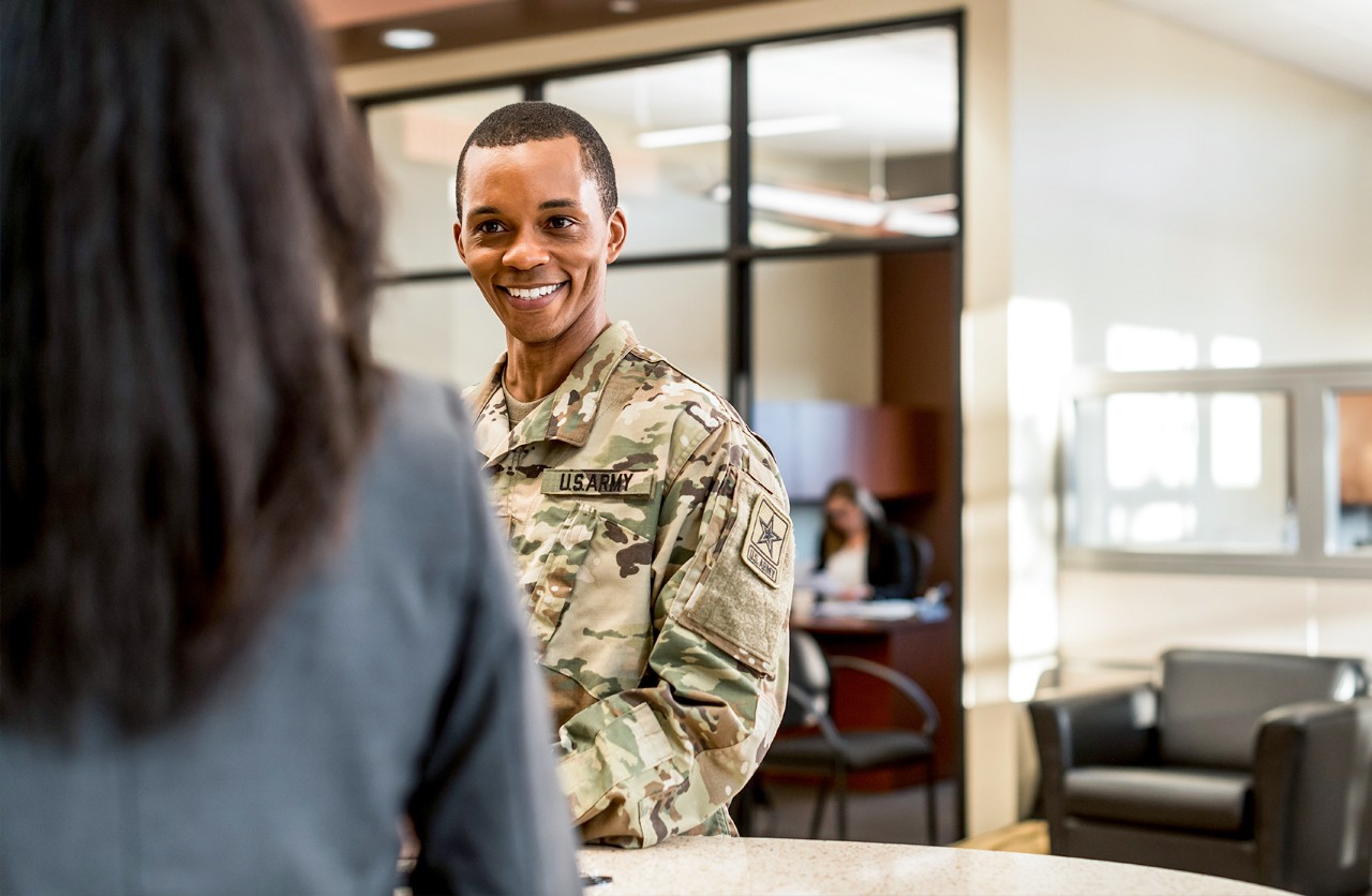 Uniformed active duty servicemember opening a military checking account inside a U.S. Bank branch