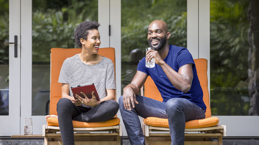 Couple relaxing in their yard