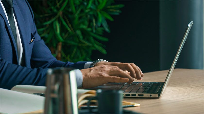 Person typing at computer