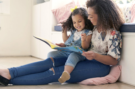 Mother and daughter reading a book