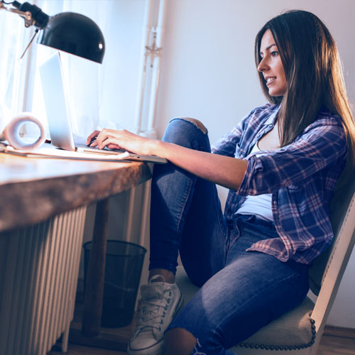 Woman opening IRA using laptop