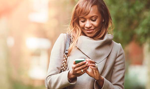 Woman outside using mobile phone