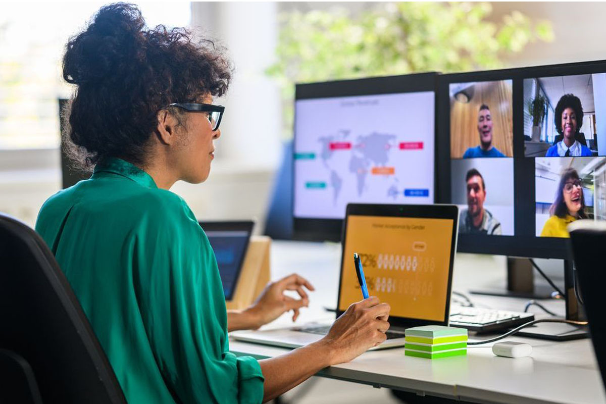 woman attending a virtual meeting on her computer