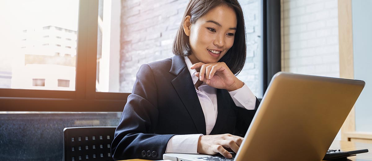 Business woman at a desk using a laptop