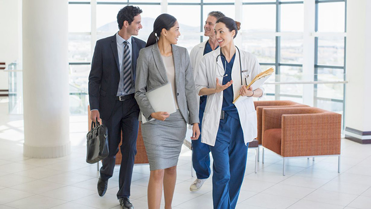 doctors and business people walking together