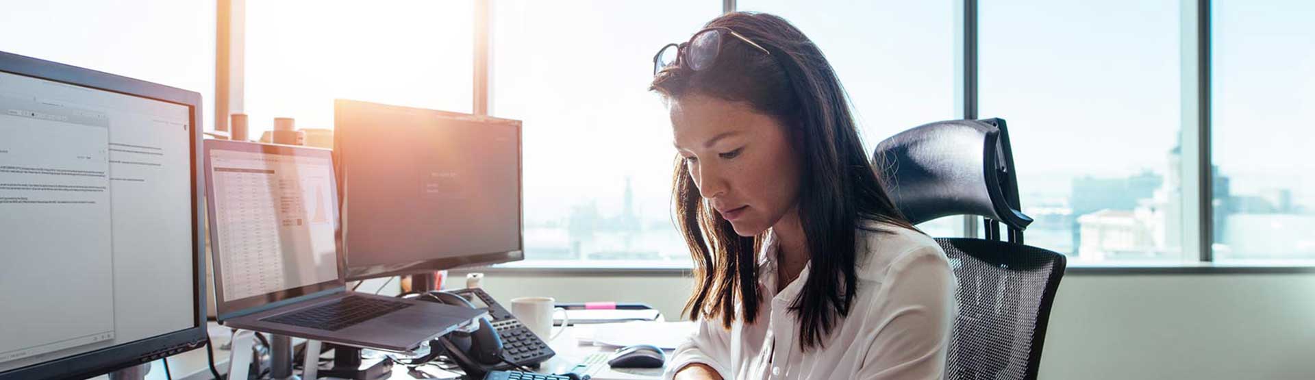 woman doing work at her desk