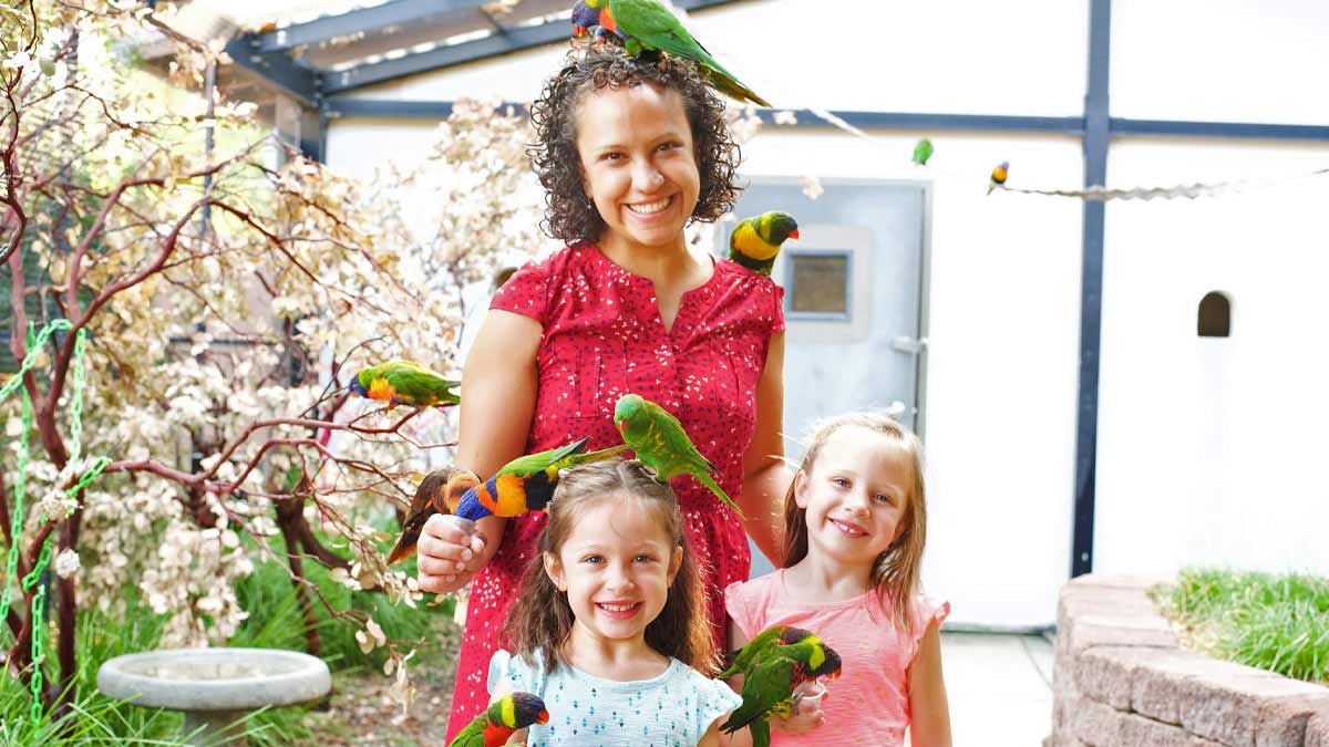 Family interacting with birds.