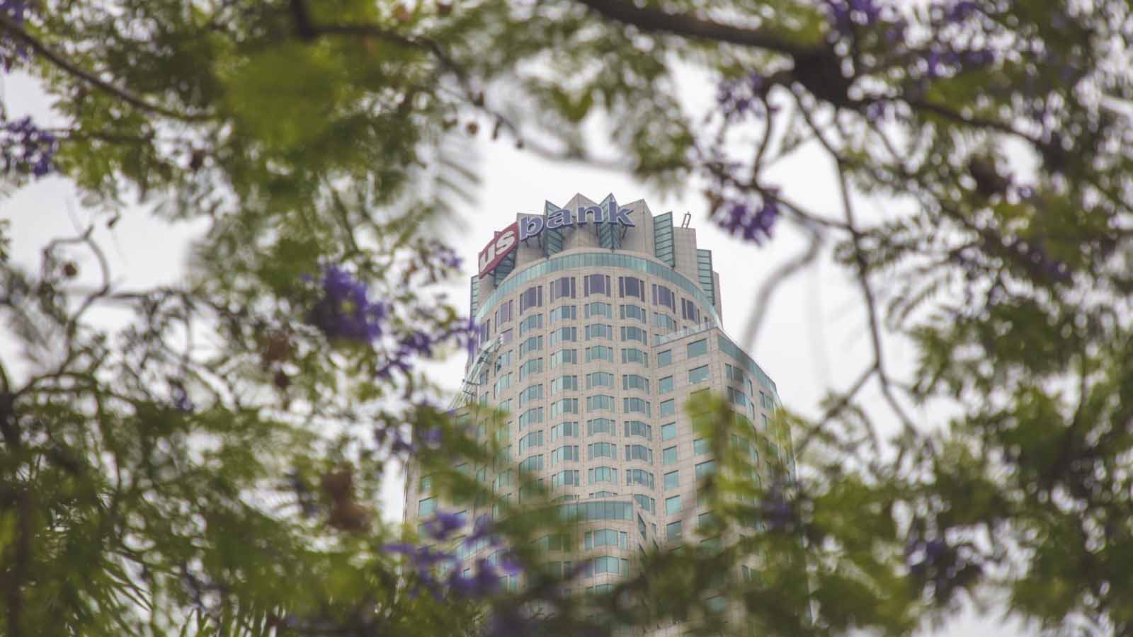 U.S. Bank tower framed by flowering trees