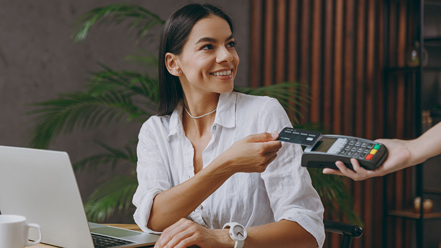 Woman swiping credit card