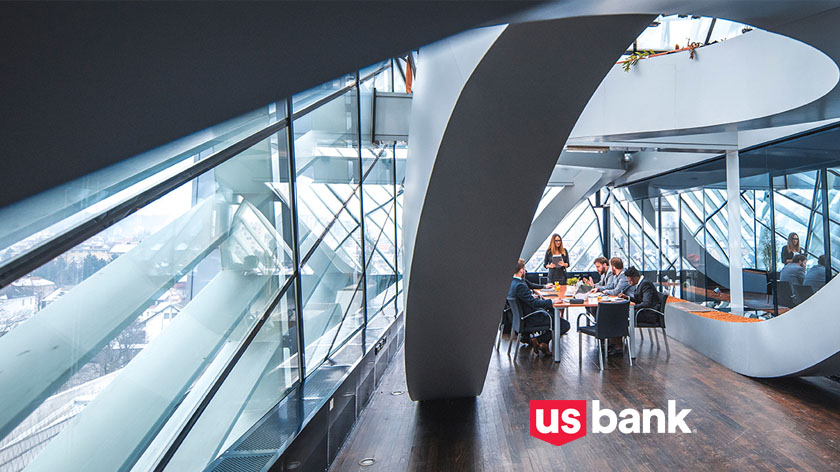 Meeting in modern office building with U.S. Bank logo